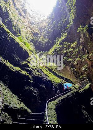 Algar do Carvao (Cavern of Coal) is an ancient lava tube or volcanic vent, Azores, Furnas do Enxofre, Geology, naturenatural, Portugal, Terceira, volcanic trail, volcano nature park Stock Photo