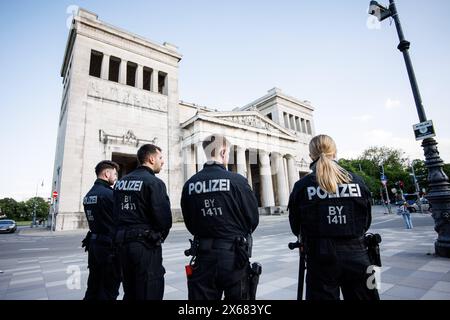 Munich, Germany. 13th May, 2024. Police officers stand in front of a pro-Palestine protest camp on Königsplatz. Credit: Matthias Balk/dpa/Alamy Live News Stock Photo