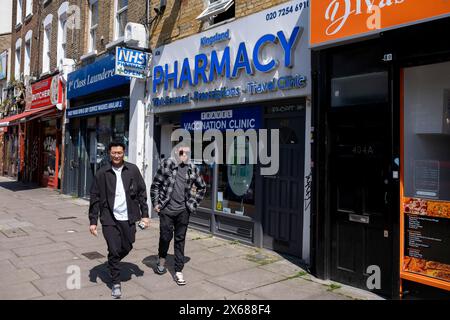 Sign for the NHS National Health Service outside a pharmacy on 8th May 2024 in London, United Kingdom. Stock Photo