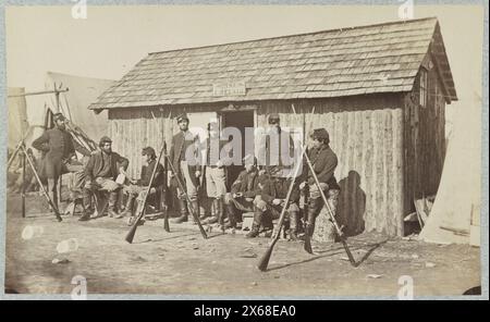 Soldiers outside a log cabin winter quarters, identified as 'Pine Cottage', Civil War Photographs 1861-1865 Stock Photo