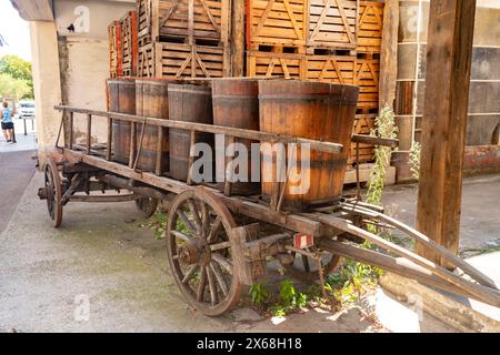 Wine barrels on a historic wooden cart, Ribeauville, Alsace, France Stock Photo