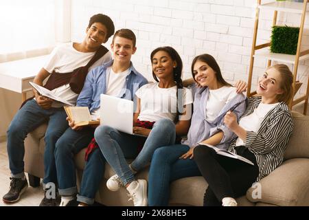Group of Five Young Students Studying Together at Home Stock Photo