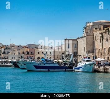 Commercial fishing trawlers, berthed in Trani, Italy. Stock Photo