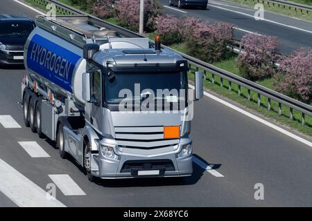 Truck with hydrogen tank trailer. Hydrogen transportation concept Stock Photo