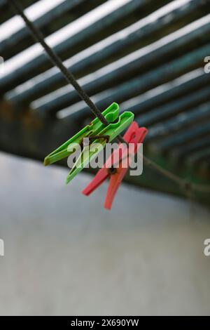 Clothespins hanging on an old washing line Stock Photo