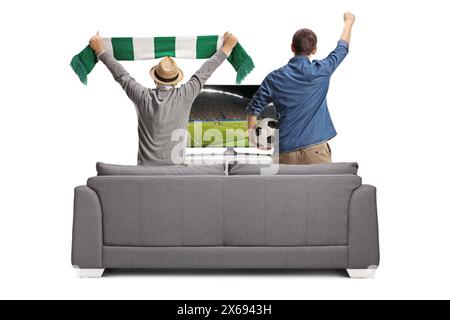 Rear view shot of a younger and older man watching football match on tv and cheering isolated on white background Stock Photo