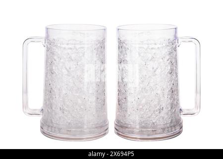 Two empty beer mugs with ergonomic handle isolated on white background with copy space Stock Photo
