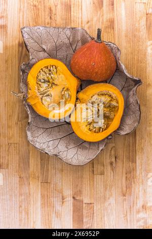 Two halves of raw organic pumpkin with seeds, Food-Stilllife Stock Photo