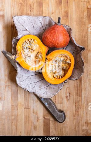 Two halves of raw organic pumpkin with seeds, Food-Stilllife Stock Photo