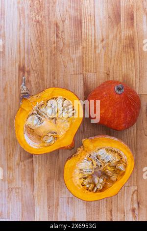 Two halves of raw organic pumpkin with seeds, Food-Stilllife Stock Photo