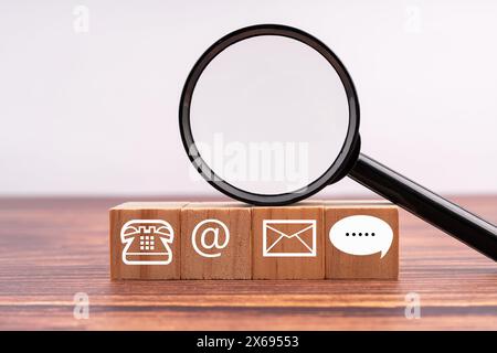 Contact Us symbol and magnifying glass business concept Stock Photo