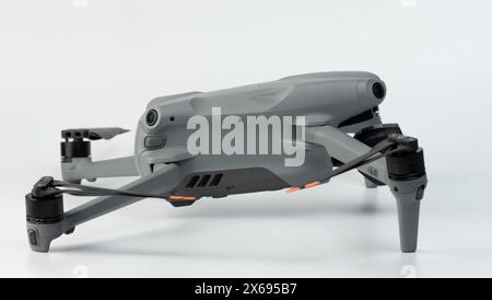 Modern gray drone aircraft side view isolated on studio background Stock Photo