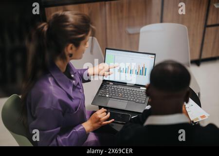 Multicultural business team collaborates on a project in a modern office Stock Photo