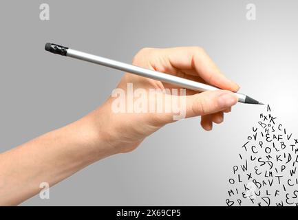 Woman writing letters and they flying away on grey gradient background, closeup Stock Photo