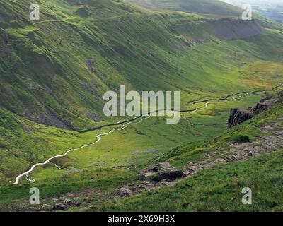 view of spectacular iconic steep-sided geological glacial valley of High Cup Nick with winding silver stream in Northern Pennines Cumbria, England, UK Stock Photo