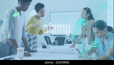 A group of diverse businesswomen discussing something at an office meeting Stock Photo