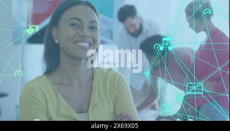 Image of icons connected with lines forming globes over smiling biracial woman Stock Photo