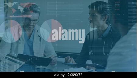 Image of data processing over diverse group of doctors Stock Photo
