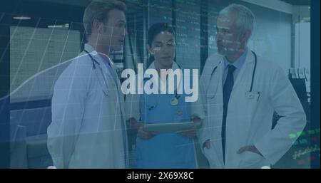 Image of data processing over diverse group of doctors Stock Photo