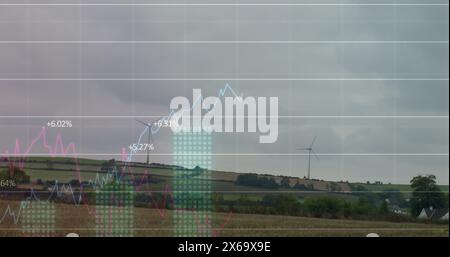 Image of financial data processing over wind turbine Stock Photo
