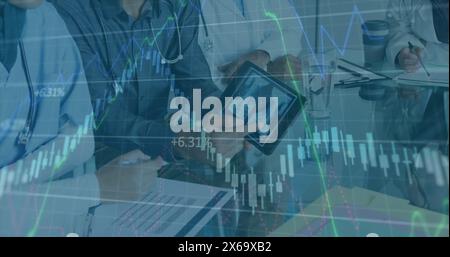 Image of data processing over diverse group of doctors Stock Photo