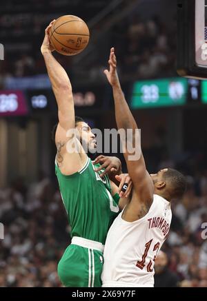 Cleveland, United States. 13th May, 2024. Boston Celtics Jason Tatum (0) attempts to dunk over Cleveland Cavalier's Tristan Thompson (13) in the first half of the Eastern Conference semi finals game 4 at Rocket Mortgage Fieldhouse in Cleveland, Ohio Monday May, 13, 2024. Photo by Aaron Josefczyk/UPI Credit: UPI/Alamy Live News Stock Photo