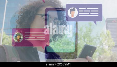 Image of message box icons over cellphone against smiling biracial man typing on cellphone Stock Photo