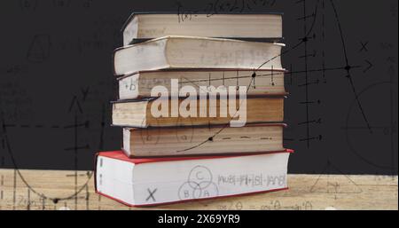 Image of stack of books over mathematical equations and formulae Stock Photo