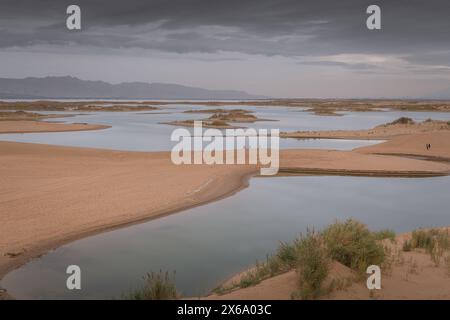 The lake in the middle of the desert. A unique landscape of Wuhai city in Inner Mongolia, China. Dramatic sky with copy space for text Stock Photo