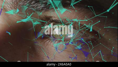Caucasian young professional examining digital interfaces overlaid on his eye Stock Photo