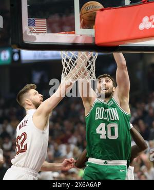 Cleveland, United States. 13th May, 2024. Boston Celtics Luke Kornet (40) dunks over Cleveland Cavaliers Dean Wade (32) in the first half of the Eastern Conference semi finals game 4 at Rocket Mortgage Fieldhouse in Cleveland, Ohio on Monday, May, 13, 2024. Photo by Aaron Josefczyk/UPI Credit: UPI/Alamy Live News Stock Photo