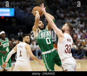 Cleveland, United States. 13th May, 2024. Boston Celtics Jayson Tatum (0) shoots over Cleveland Cavaliers Dean Wade (32) in the second half of the Eastern Conference semi finals game 4 at Rocket Mortgage Fieldhouse in Cleveland, Ohio on Monday, May, 13, 2024. Photo by Aaron Josefczyk/UPI Credit: UPI/Alamy Live News Stock Photo