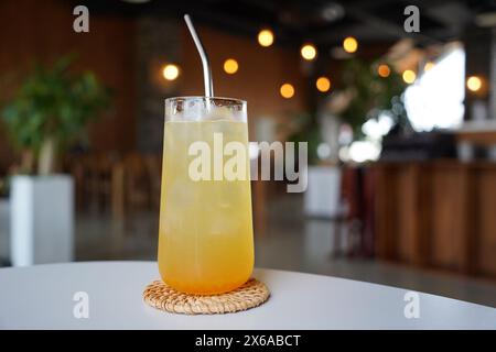 Refreshing lemonade in a glass on a table in a cafe Stock Photo
