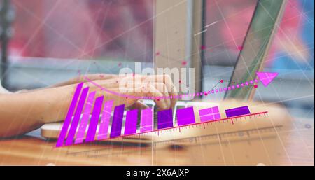 Person analyzing financial data, colorful graphs overlaying screen Stock Photo