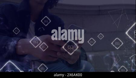 Image of 6g text banners over biracial man using smartphone sitting on the stairs Stock Photo