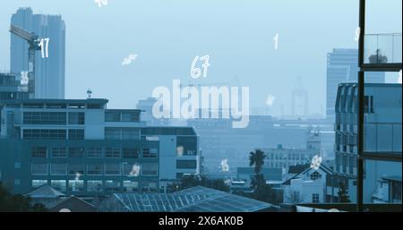 Image of numbers and data processing over cityscape Stock Photo