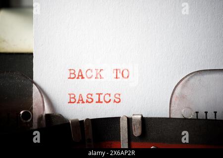 Back to basics text written with a typewriter. Stock Photo