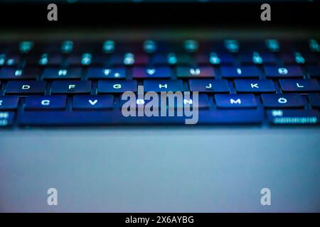 Detailed close-up of laptop keys, highlighting their sleek design and responsive typing experience. Stock Photo