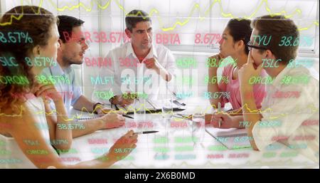 Image of trading board over diverse coworkers sharing ideas in meeting at office Stock Photo