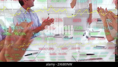 Image of trading board over diverse coworkers clapping for achieving targets in office Stock Photo
