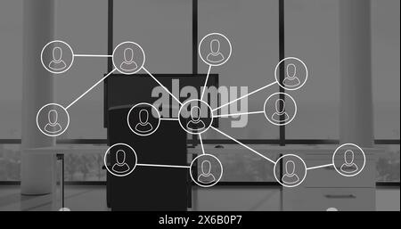 Image of network of connections with icons over office desk with computer Stock Photo