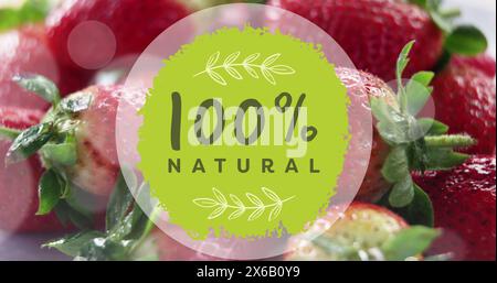 Image of 100 percent natural text over strawberries Stock Photo
