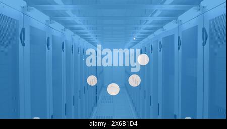 Image of white spots over server room Stock Photo