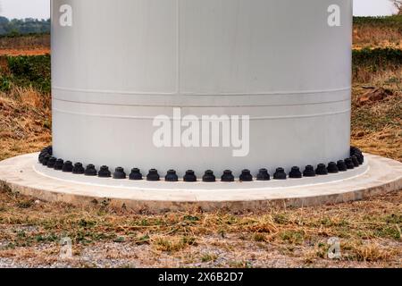 nuts and bolts of the wind turbine at foot many pance for a strong foundation. Stock Photo