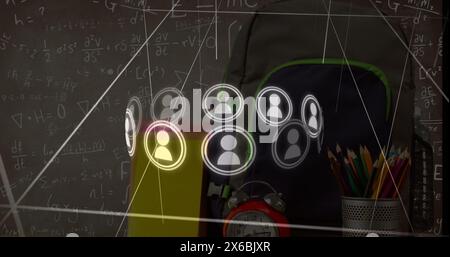 Image of lines and icons over school items and mathematical equations Stock Photo