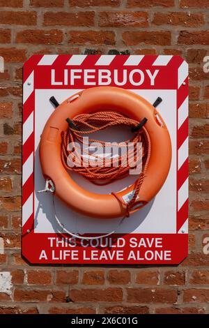 A lifebuoy situated on a brick wall at the Diglis Basin, Worcester, part of the Birmingham Worcester Canal. Stock Photo