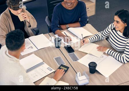 Team diversity, startup and strategy for business with people from above for planning, budget and brainstorming at table. Men, women and together in Stock Photo