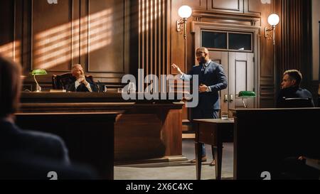 Court of Law Trial in Session: Portrait of Charismatic Male Public Defender Making Touching, Passionate Speech to Judge and Jury. Attorney Lawyer Protecting Client, Presenting Case. Stock Photo