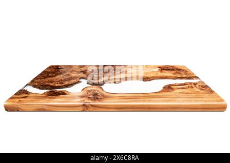 Live edge elm burl slab table top with central epoxy resin river on white background, perspective view of elm epoxy table top Stock Photo