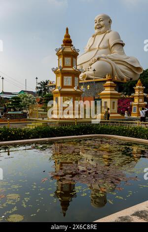 The buddha of the Vinh Trang Pagoda at My Tho in Vietnam Stock Photo